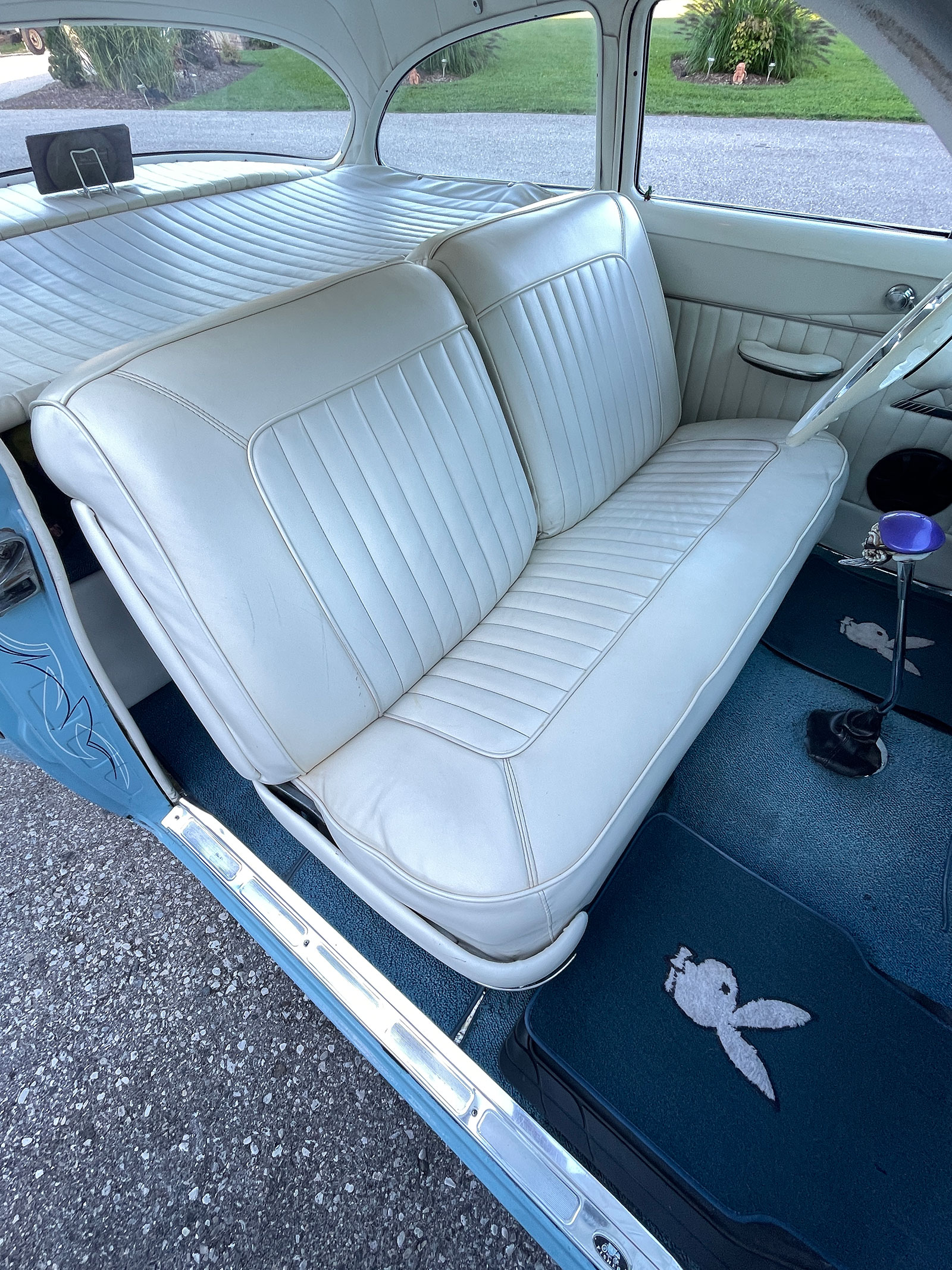 13 The Chevy 210 s white vinyl rolls and pleats crafted by Gold Star Upholstery