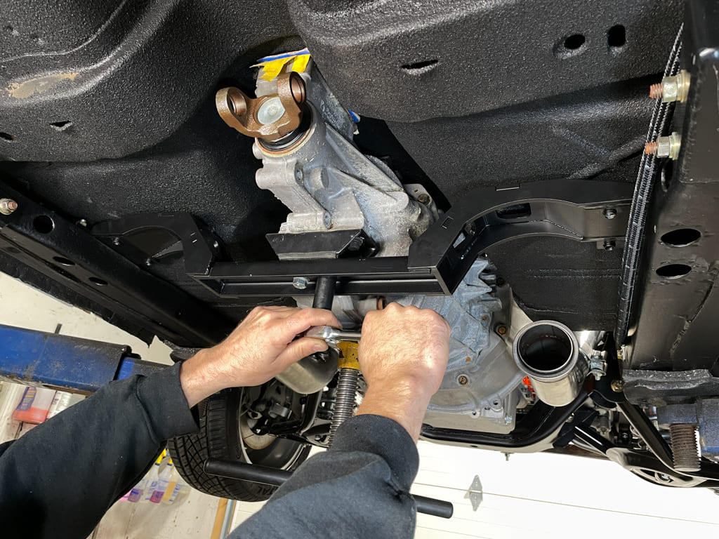 012 Follow by lowering the weight of the transmission and crossmember onto the subframe