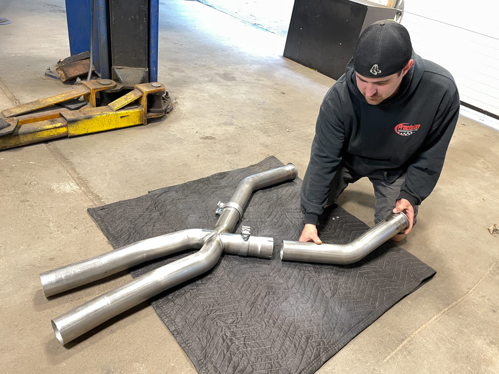 020 Start the exhaust install by laying out the front of the system on the shop floor to prepare it for fitment