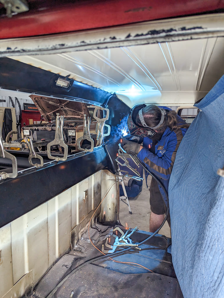 25 Howe moves to the inside of the cab to continue welding the panel into the truck