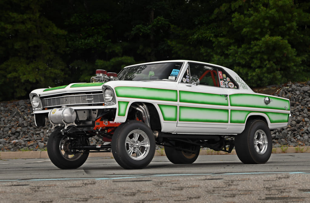002 green and white drag raised front end and large rear tires 1966 chevy nova