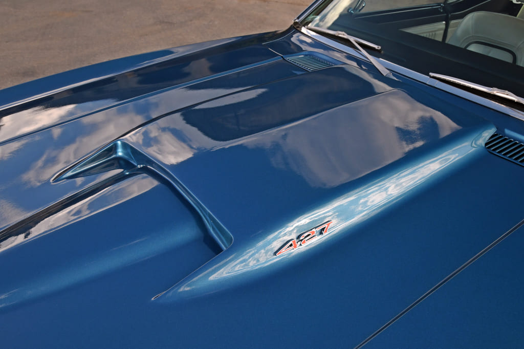 019 hood with a blue finish and chrome hood pins 1967 camaro