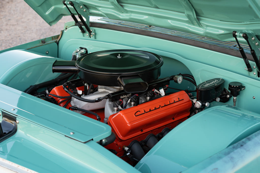 10 Engine bay of a 1968 Chevrolet C10 red engine teal body