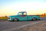 03 Vintage teal 1968 Chevy C10 side view sunset lighting
