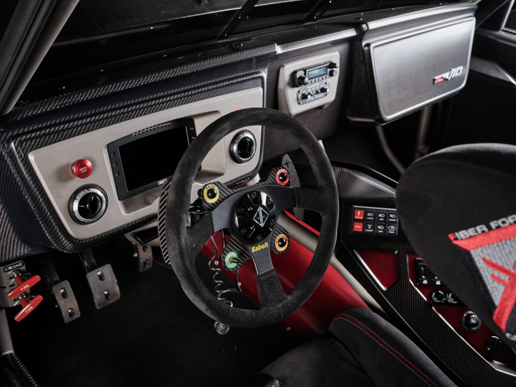14 Interior cockpit view of a 1967 Chevy C10 with carbon fiber accents and digital displays