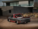 09 Ground level view of the custom 1967 Chevrolet C10 against an industrial backdrop