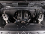 12 The engine bay of a 1967 Chevy C10 featuring a carbon fiber finish and V8 engine