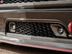 22 Detailed view of the Chevrolet C10's front grille and fog light with red tow hook