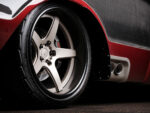 26 Custom wheel and exhaust detail of the Chevrolet C10 with red accents