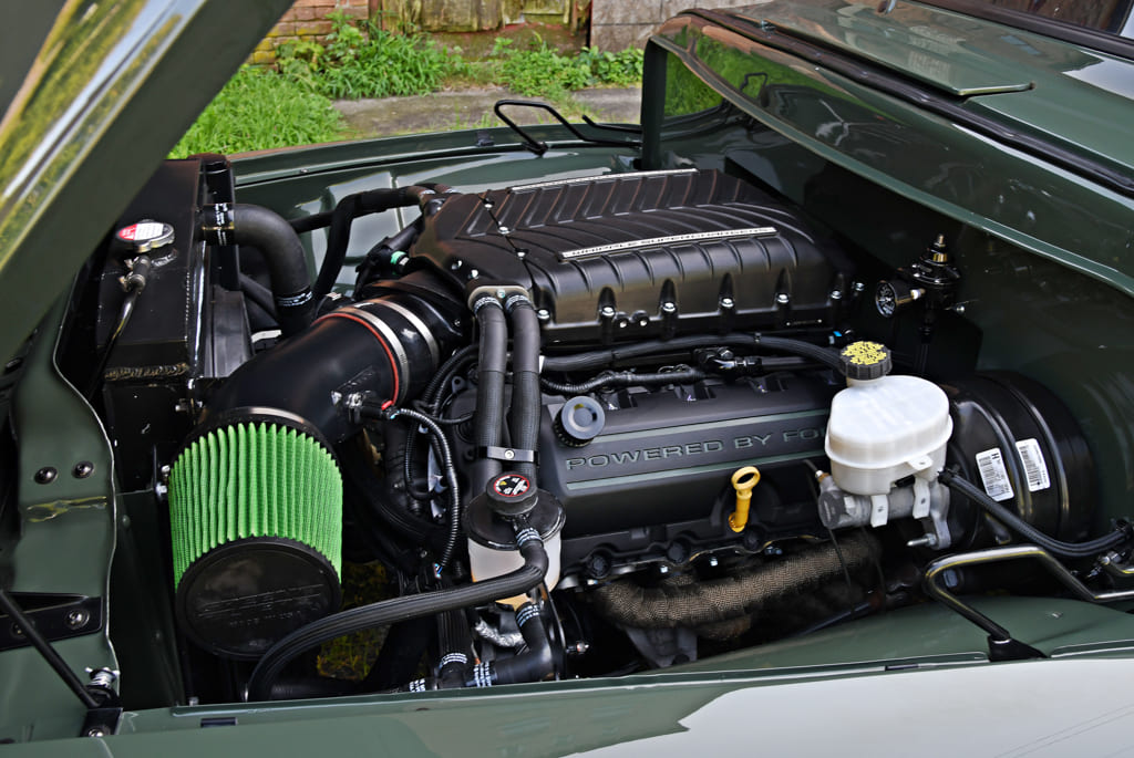 08 Engine bay of a 1954 Ford F100 showing modern upgrades