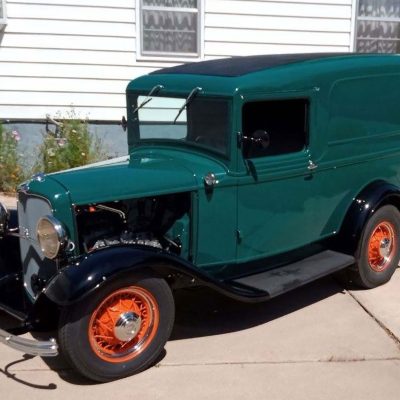02 Present day 1932 Ford panel truck with a renewed green and black paint job maintaining its original 298 inch Flathead engine