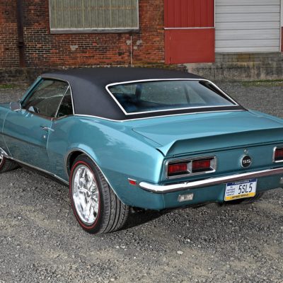 005 Rear three quarter view of a teal 1968 Camaro SS with black vinyl top