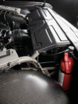 13 Detailed view of the carbon fiber engine components and fire extinguisher in a 1967 Chevy C10