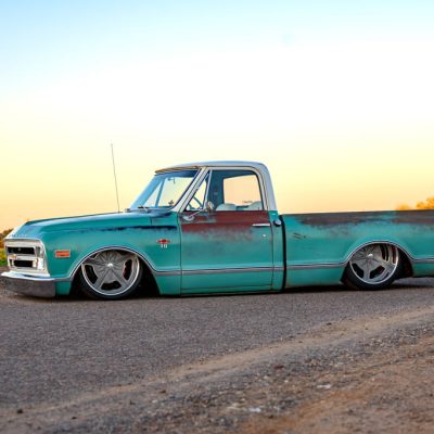 03 Vintage teal 1968 Chevy C10 side view sunset lighting